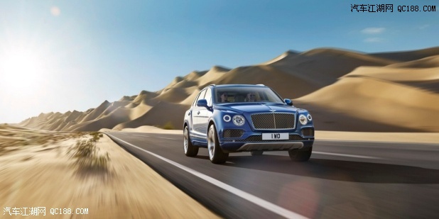 Blue Bentley Bentayga driving on the road surrounded by sand dunes | Bentley Motors